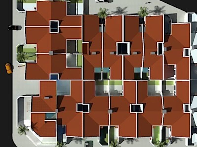 An overhead site plan showing the roof layout and positioning of multiple townhouse units within the residential complex.