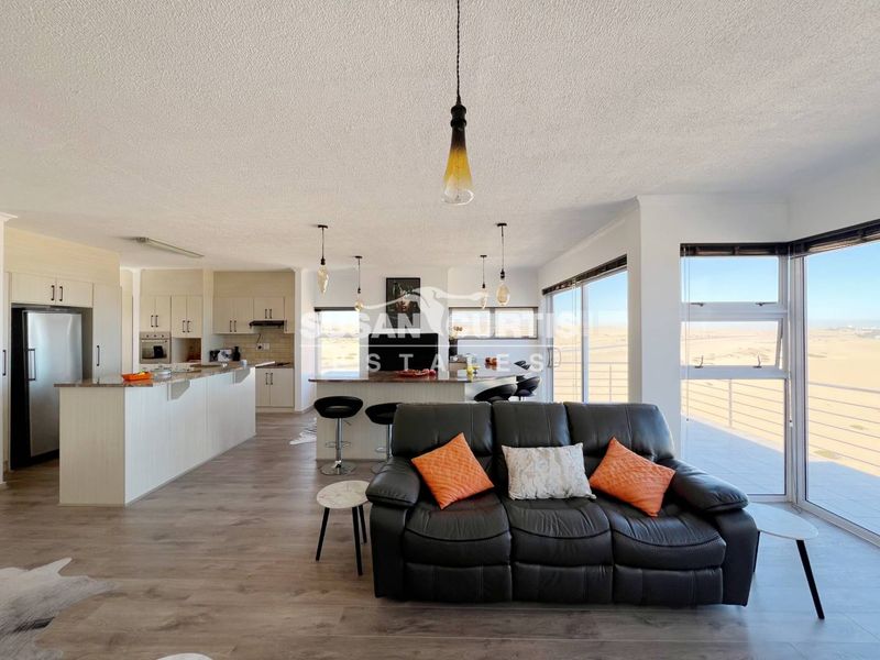Live by the Sea: Modern Penthouse with Ample Living Space - Photo 3