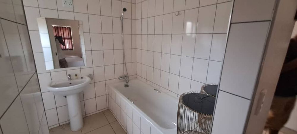 Guest bathroom with shower and bathtub