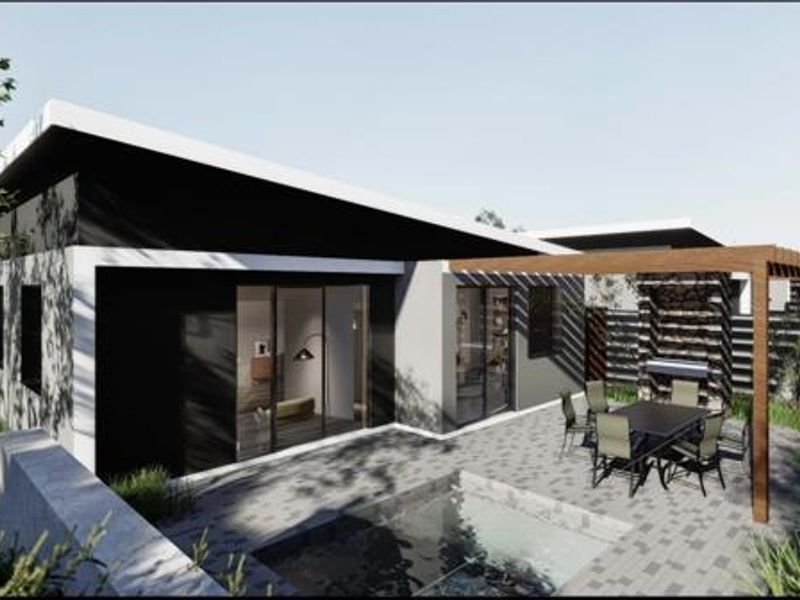 Modern rear exterior featuring a paved patio, timber pergola, built-in braai area, and a swimming pool, seamlessly connected to the interior via sliding glass doors.