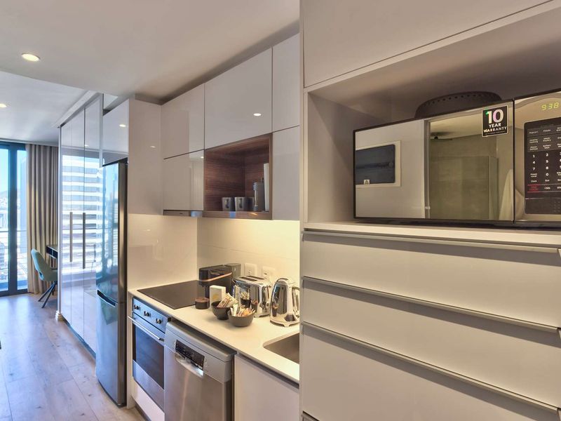 Elevated City Living | 16 On Bree Studio with Balcony | Pool & Views - Photo 6