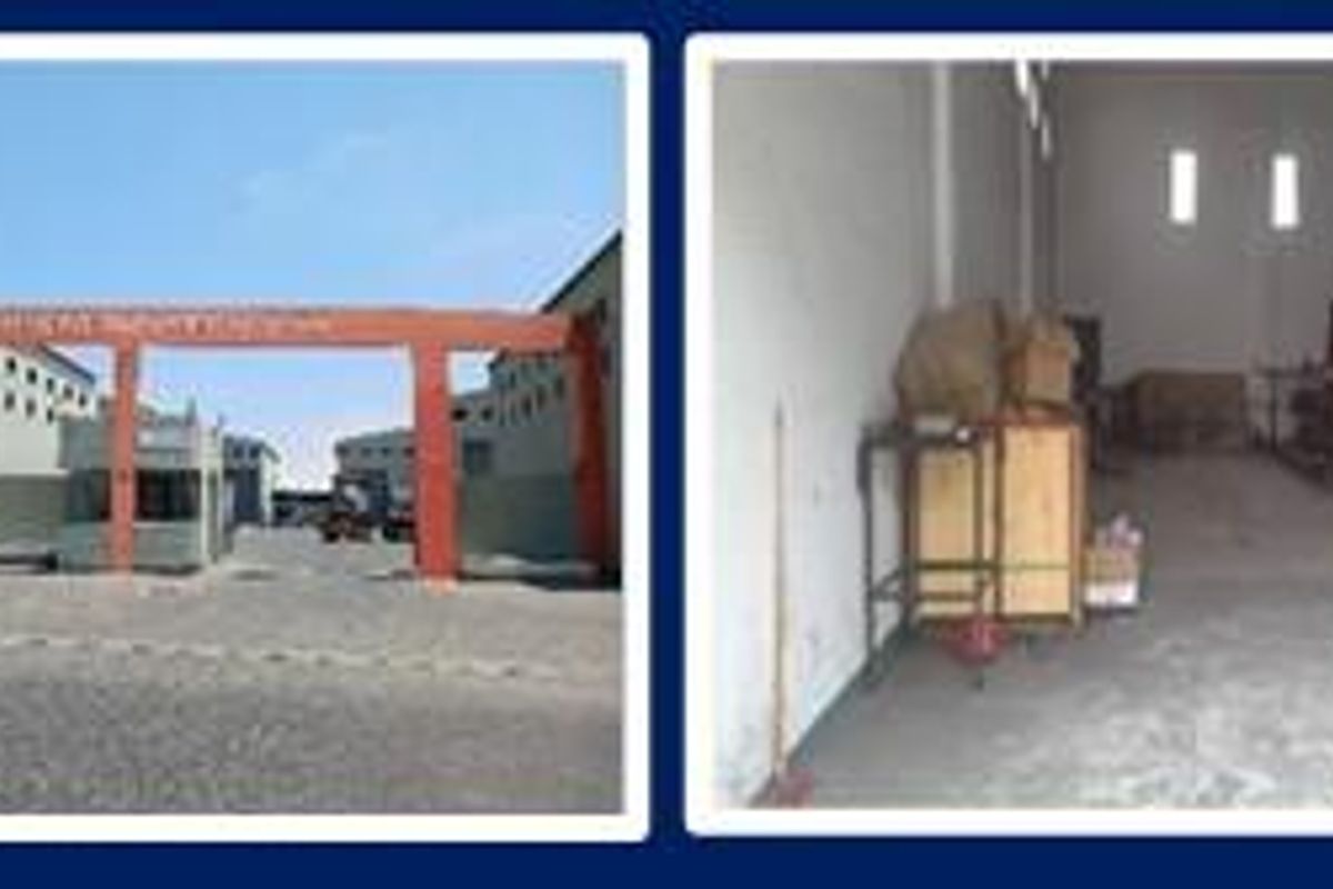 A composite view of an industrial warehouse facility featuring a gated entrance, open warehouse floor space, and an internal mezzanine level.