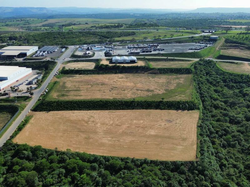 Aerial view of a large, cleared industrial land parcel situated within an established industrial precinct with direct road access.