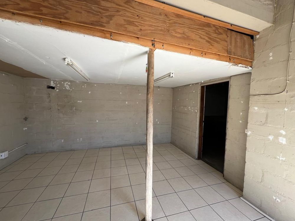 Office 1 with door leading to warehouse