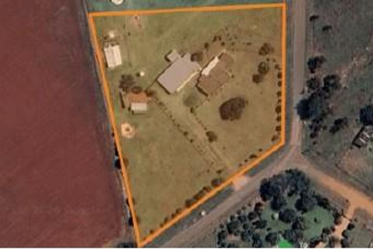Aerial view of the small holding property showing the main dwelling, outbuildings, and surrounding land boundaries.