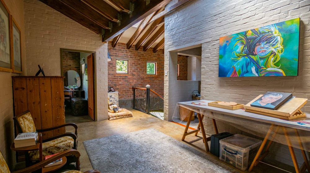 Upstairs TV room/ large studio/ study and sewing area