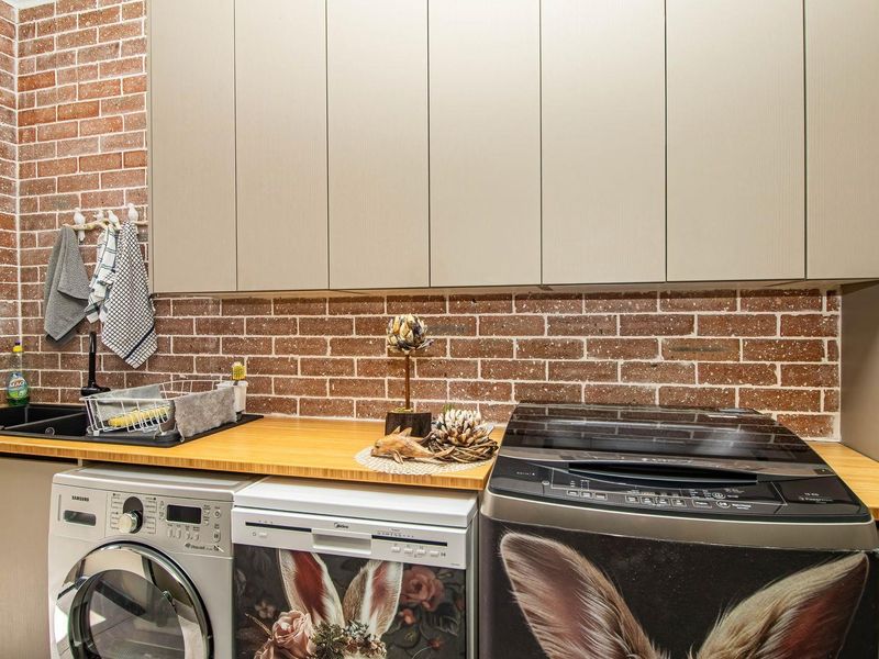 An entertainer's paradise nestled on a sprawling stand, offering a lifestyle that seamlessly blends comfort and luxury. - Photo 6