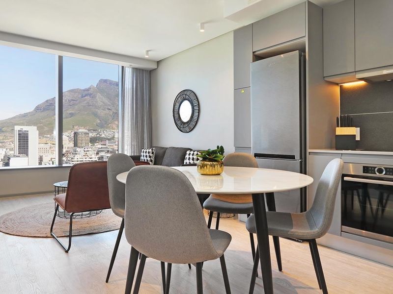 Experience City Living with a Serene Mountain Backdrop - Photo 3