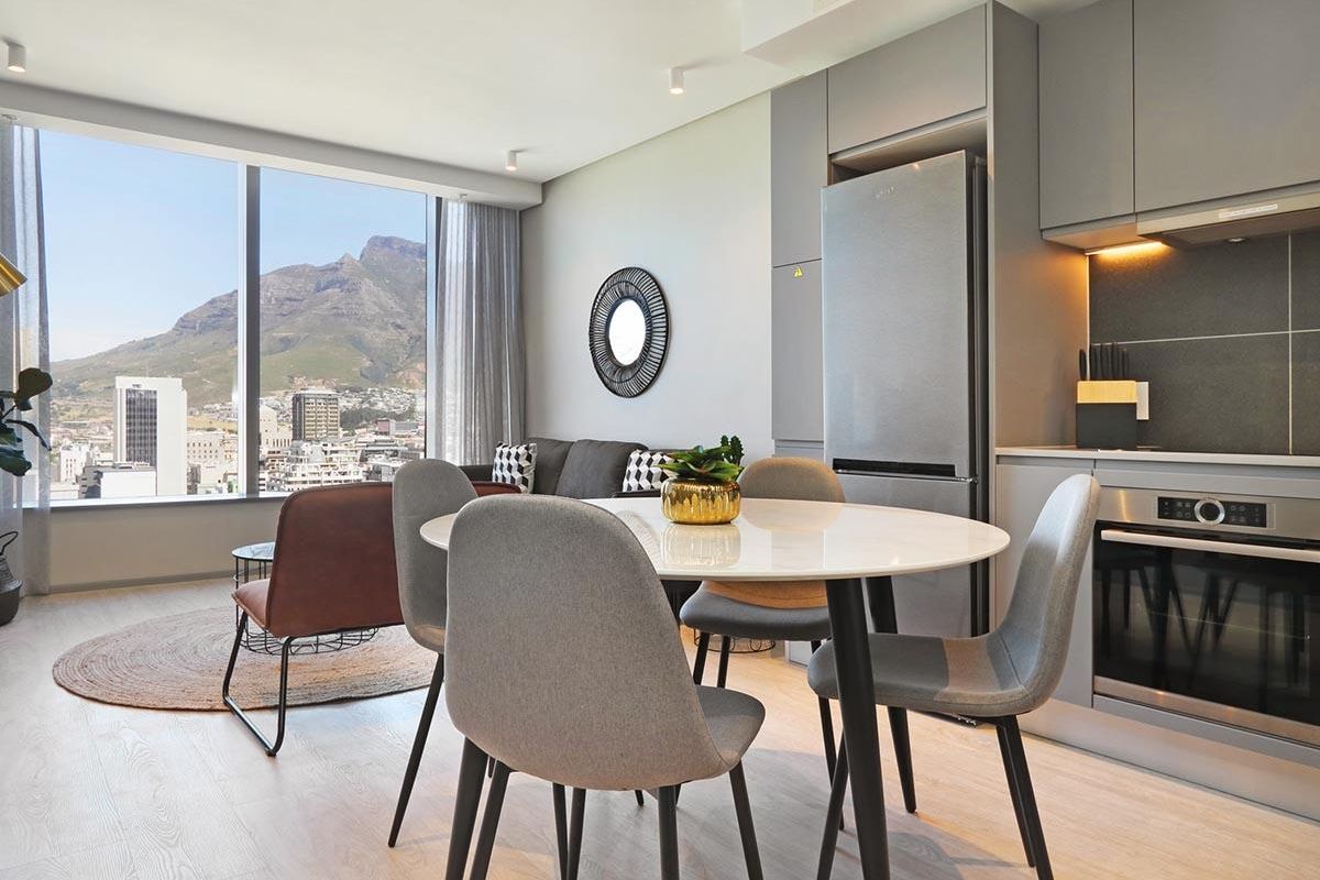 Experience City Living with a Serene Mountain Backdrop - Photo 3