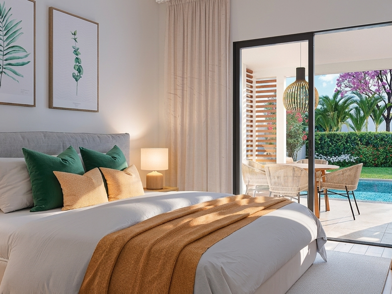 Modern bedroom featuring large sliding glass doors that open directly onto a private patio and pool area.