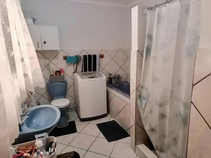 This charming 3-bedroom home offers spacious living areas, a modern kitchen, and a cozy backyard perfect for relaxation. - Photo 9