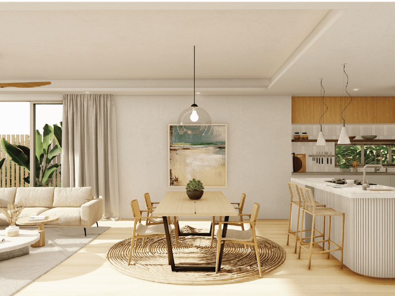 A modern open-plan living and dining area featuring a kitchen island, light hardwood flooring, and seamless access to the outdoor space.