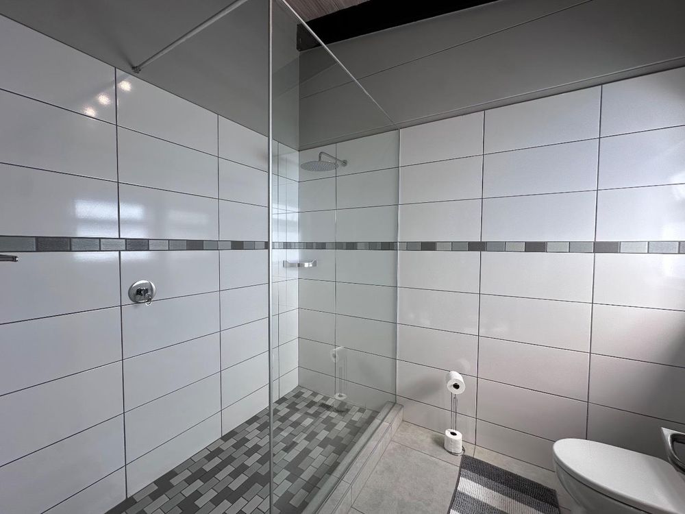 Main Flat, 2 suite bedrooms, open plan kitchen with lounge and inside barbecue and balcony.