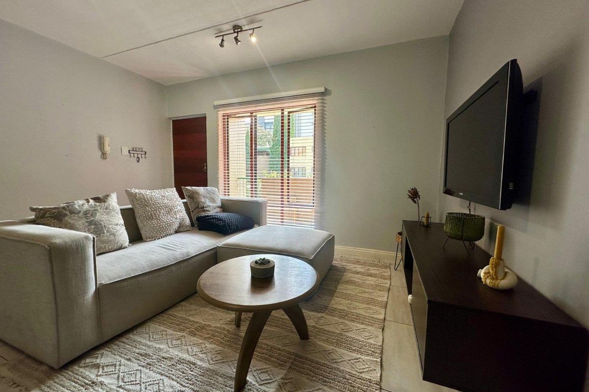 A MODERN ONE BEDROOM FURNISHED APARTMENT - Photo 2