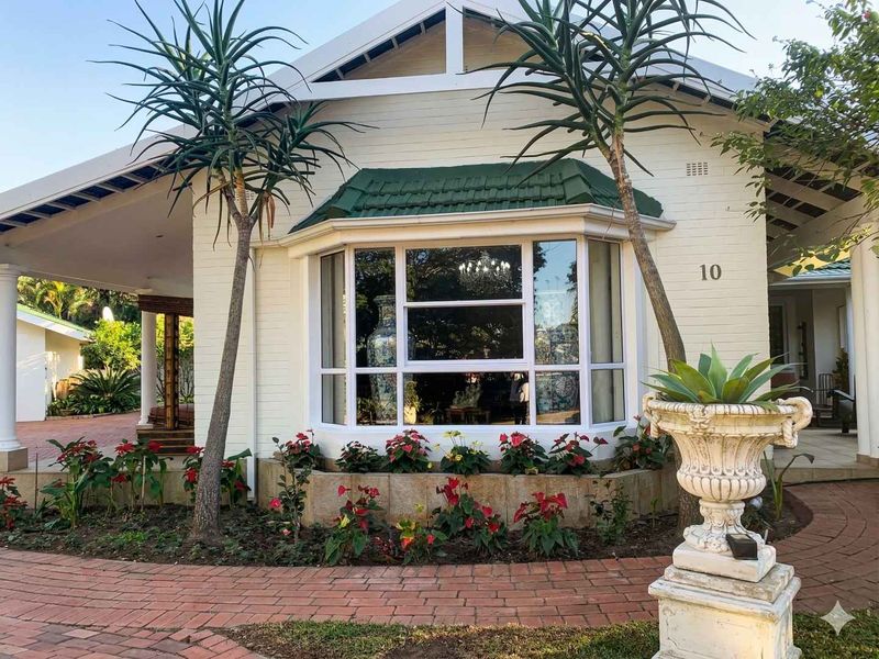 Elegant Estate Home Set on Expansive Grounds with Future Potential - Photo 2