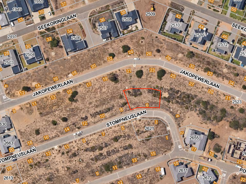 An aerial view of a vacant residential plot located on Stompneuslaan, highlighting the property boundaries and surrounding neighborhood infrastructure.