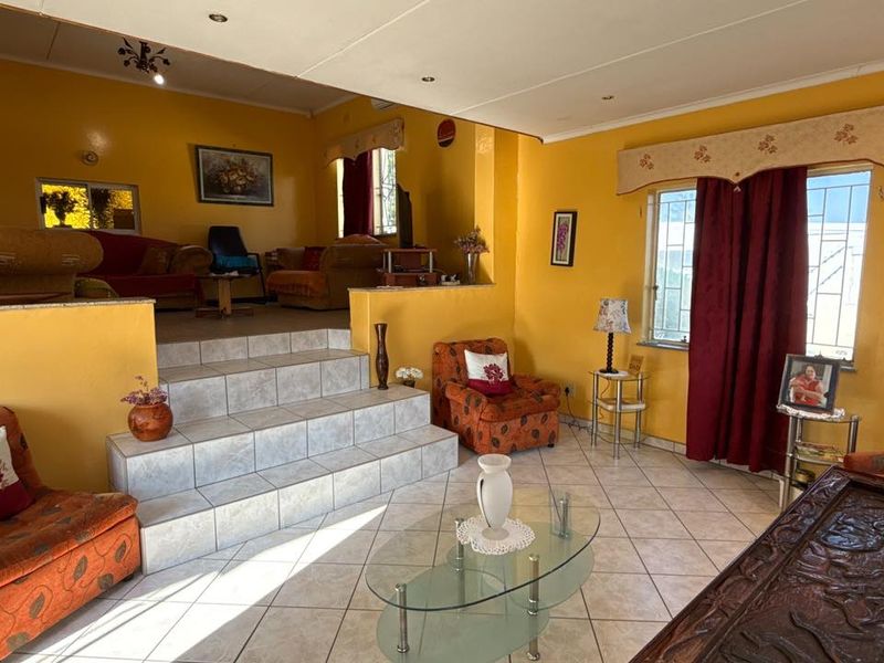 Set high above street level on a massive erf with a large front garden and elevated views - Photo 9