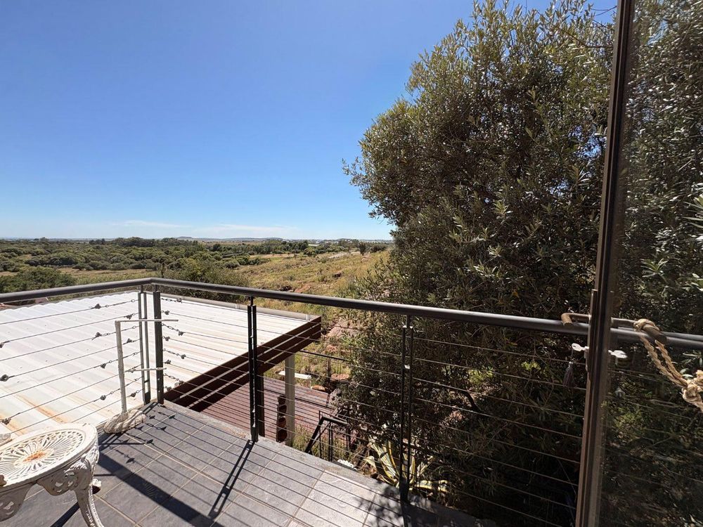 Balcony with view over the green belt.