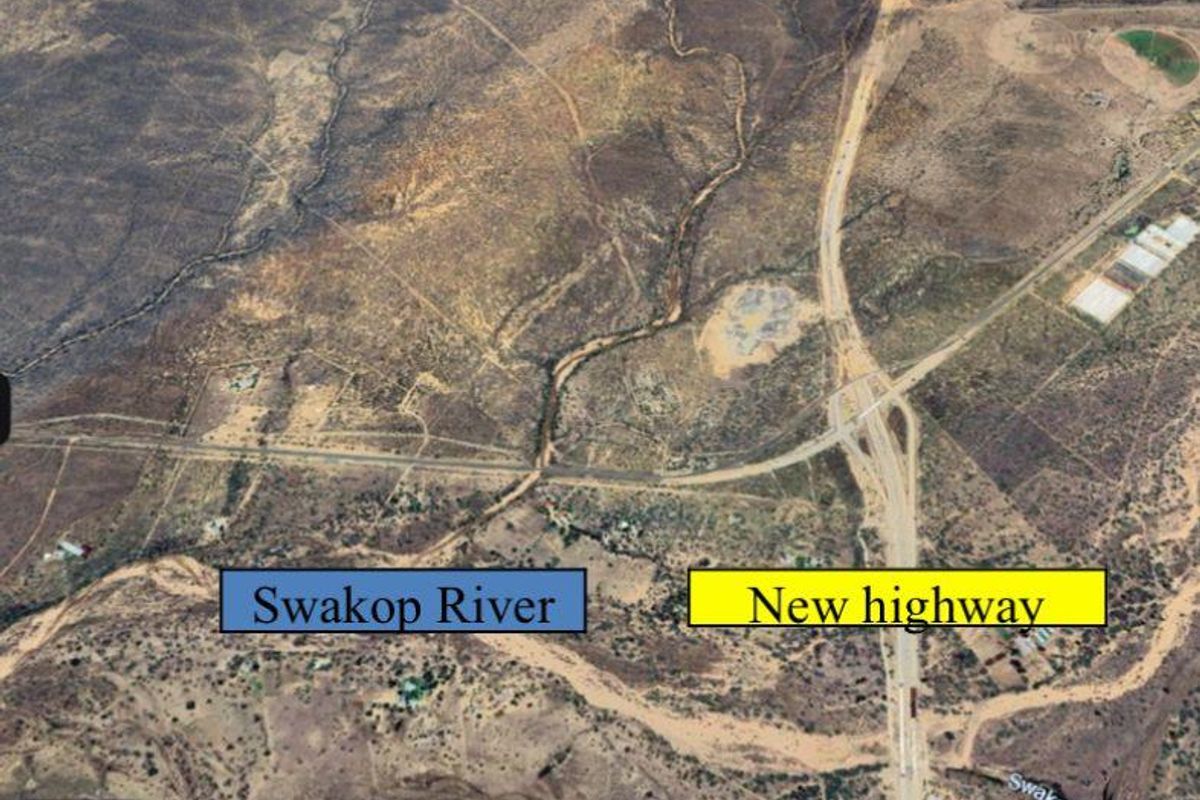 Aerial view of the property location showing the proximity to the Swakop River and the new highway infrastructure.