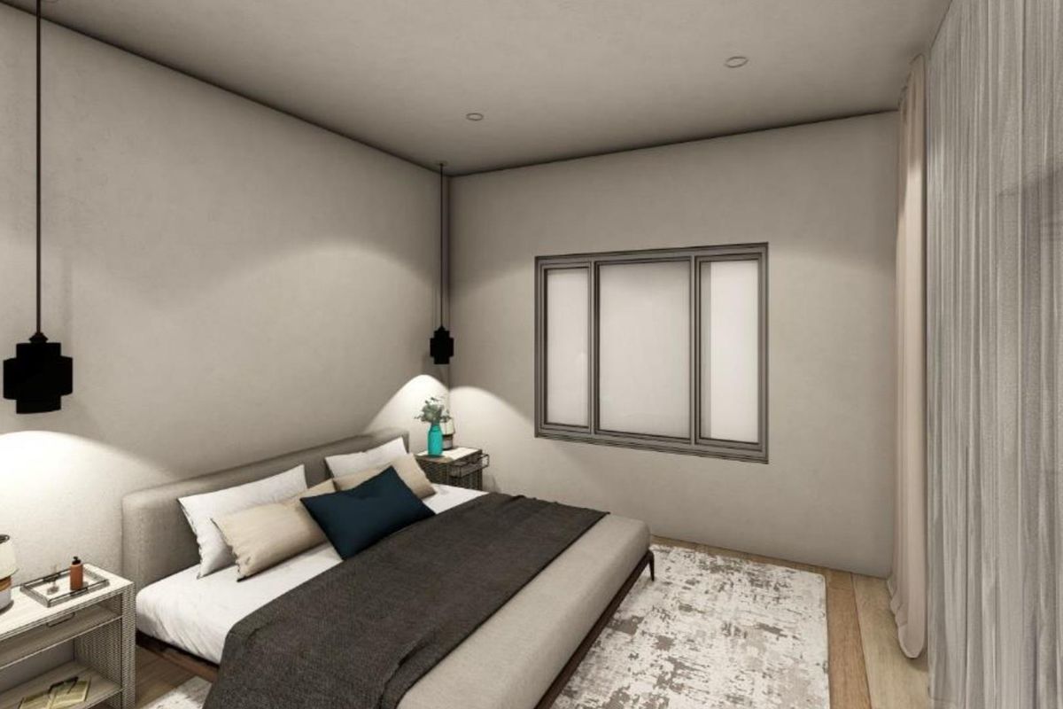 A modern bedroom featuring neutral walls, recessed ceiling lighting, and a large window, creating a bright and comfortable sleeping space.