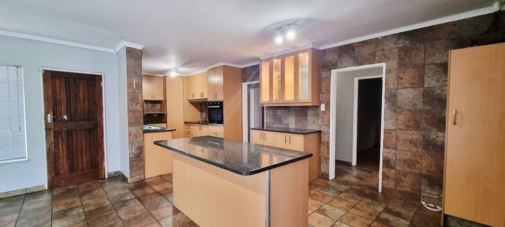 Kitchen with pantry cabinet and dining area