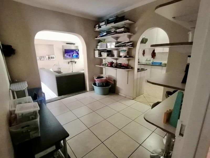 This charming 3-bedroom home offers spacious living areas, a modern kitchen, and a cozy backyard perfect for relaxation. - Photo 2