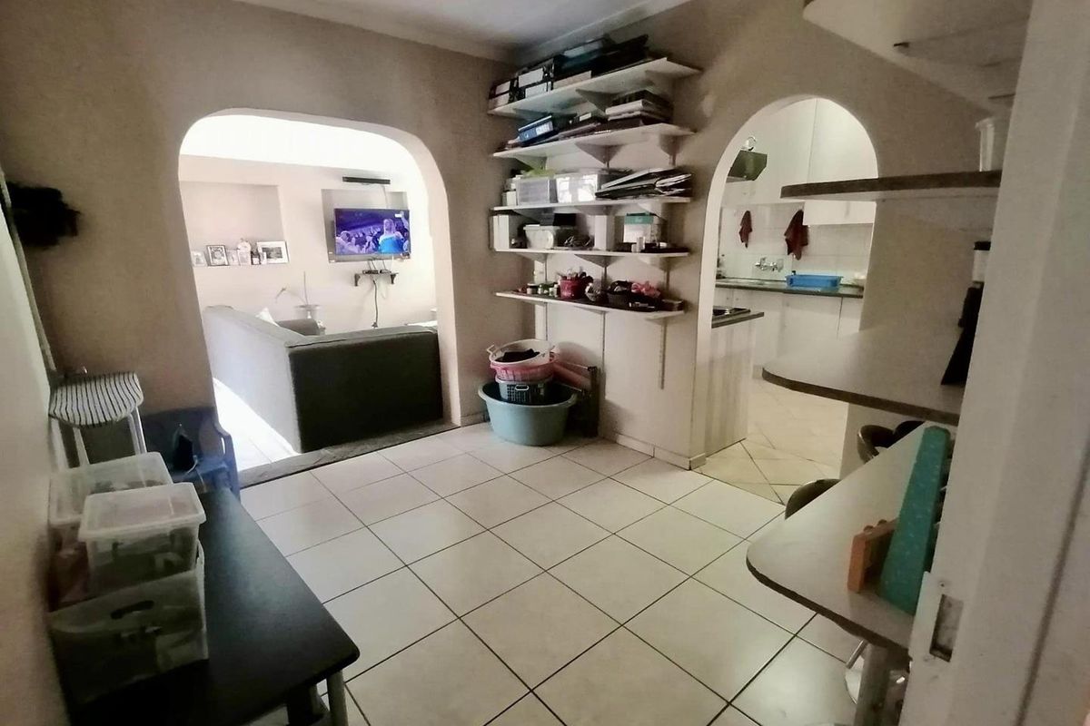 This charming 3-bedroom home offers spacious living areas, a modern kitchen, and a cozy backyard perfect for relaxation. - Photo 2