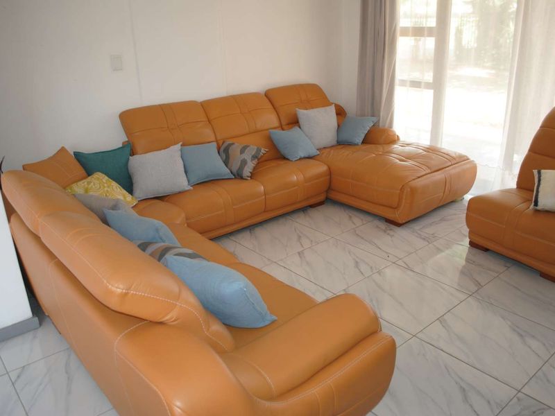 Renovated, built up, and expanded into a neat four-bedroom home with multiple living rooms and Bar area - Photo 2