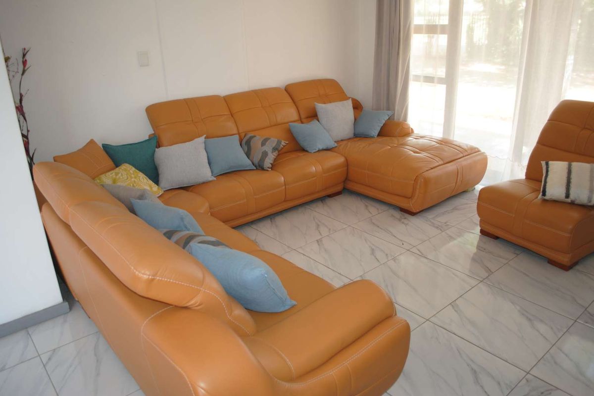 Renovated, built up, and expanded into a neat four-bedroom home with multiple living rooms and Bar area - Photo 2