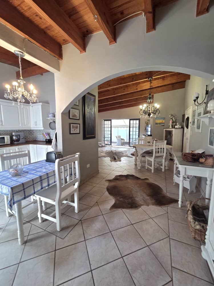 Part of kitchen and lounge view