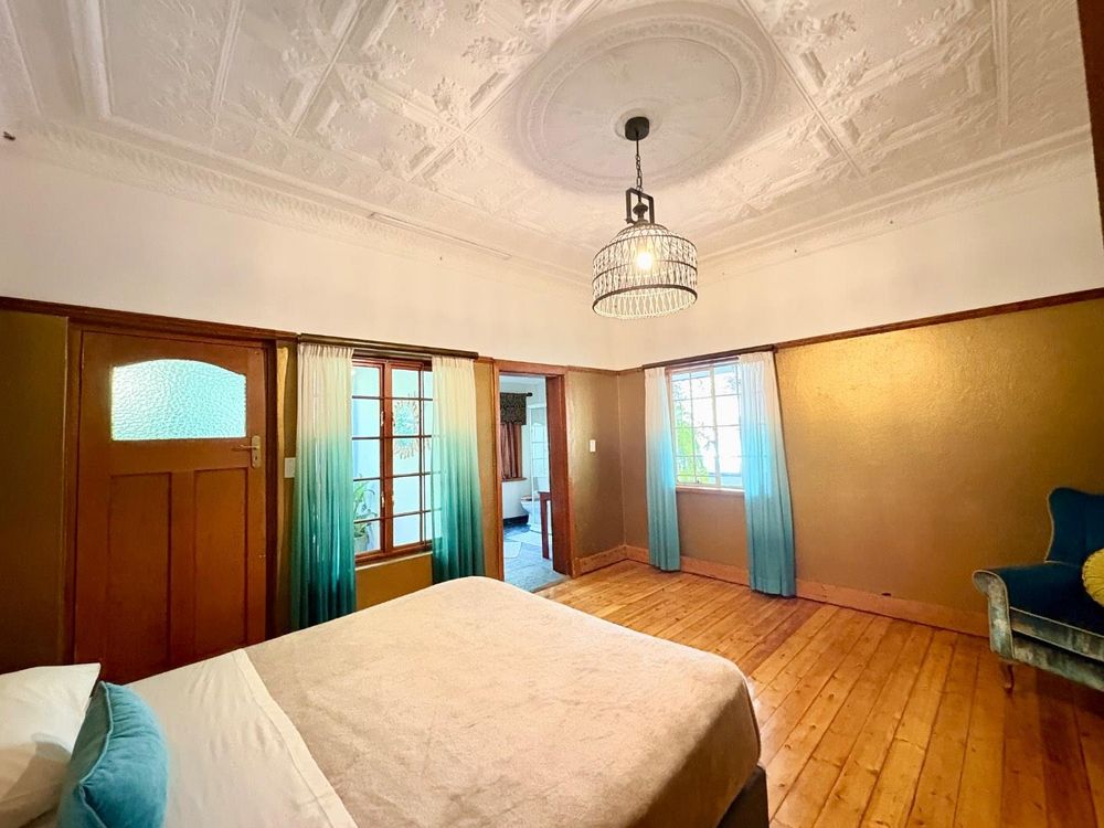 First room with en suite bathroom and door to small porch.