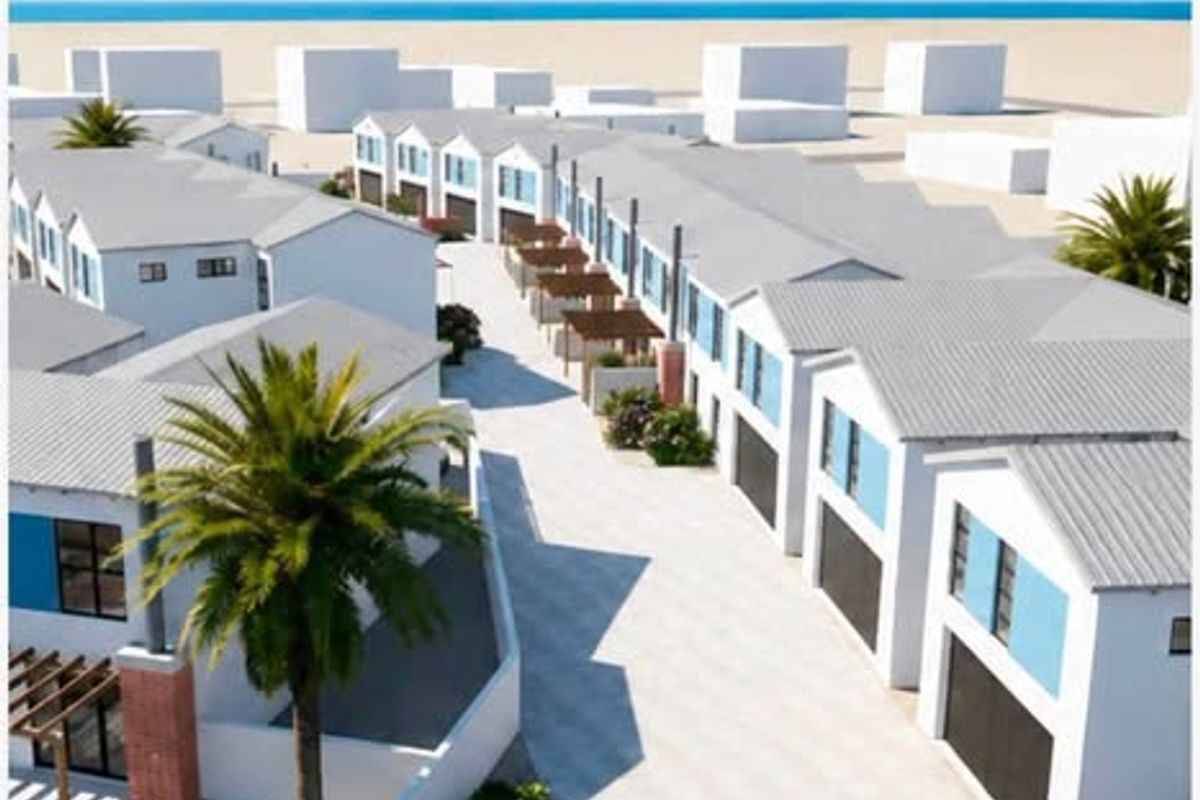 An aerial view of a modern townhouse complex featuring uniform architectural design, pitched roofs, paved driveways, and integrated garage access.