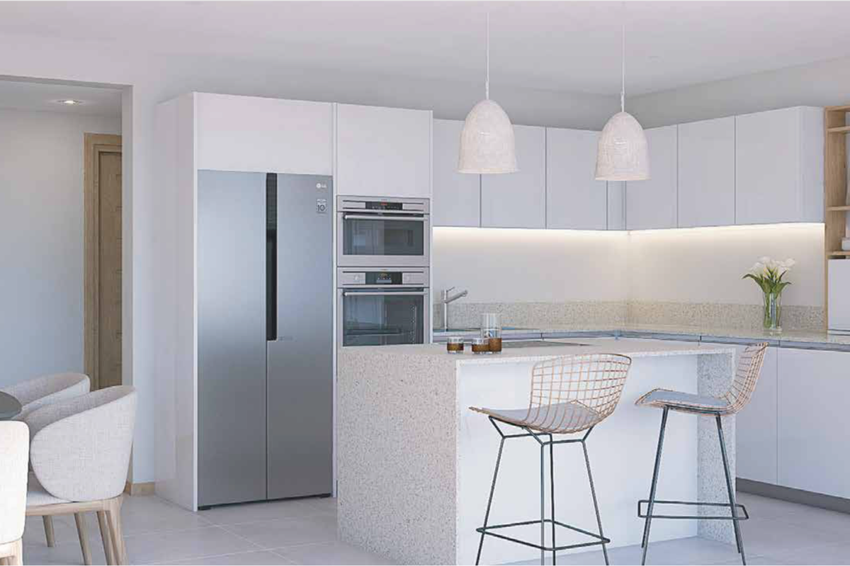 Modern kitchen featuring sleek white cabinetry, stone countertops, a central island, and integrated stainless steel appliances, creating a clean and functional culinary space.