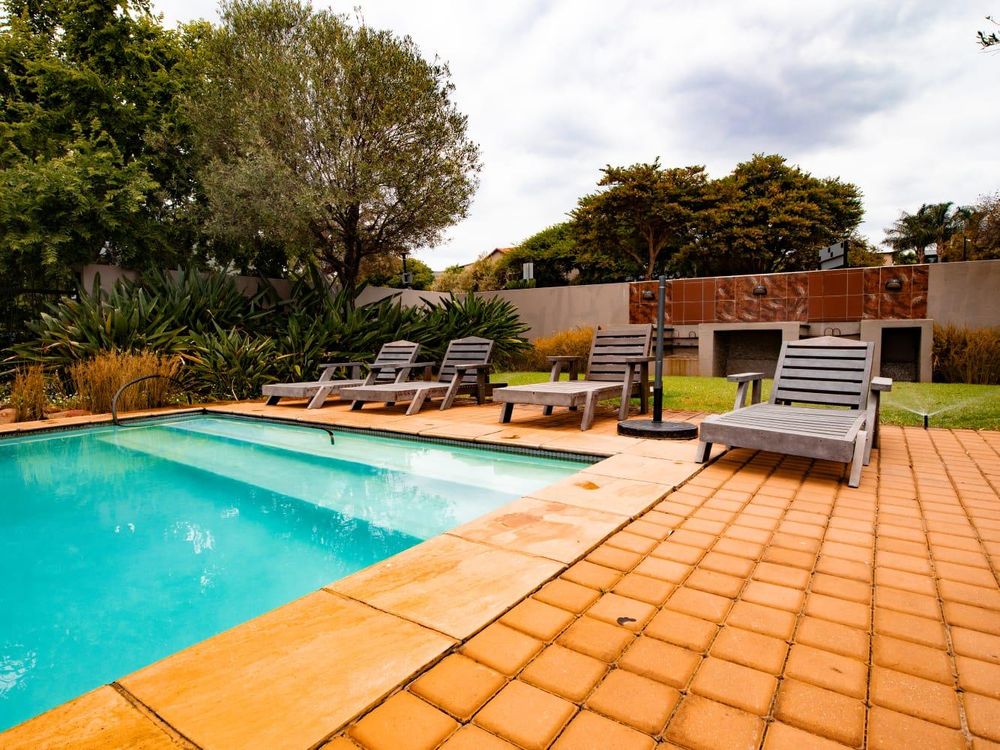 Communal pool with braai area, lounge, squash court, play areas