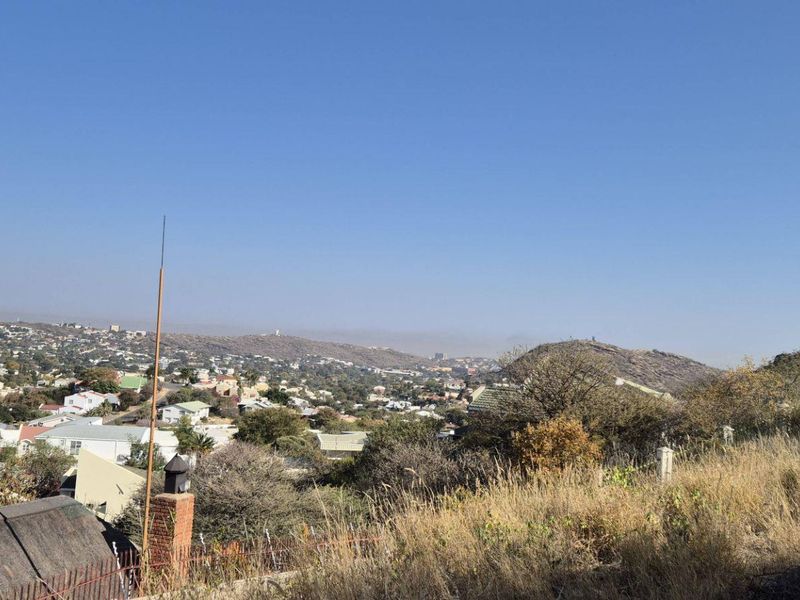 Elevated panoramic view overlooking the surrounding residential neighborhood and distant hills.