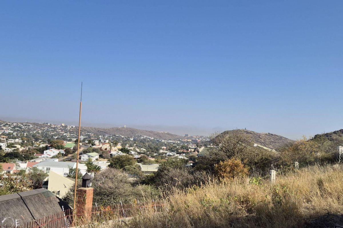 Elevated panoramic view overlooking the surrounding residential neighborhood and distant hills.