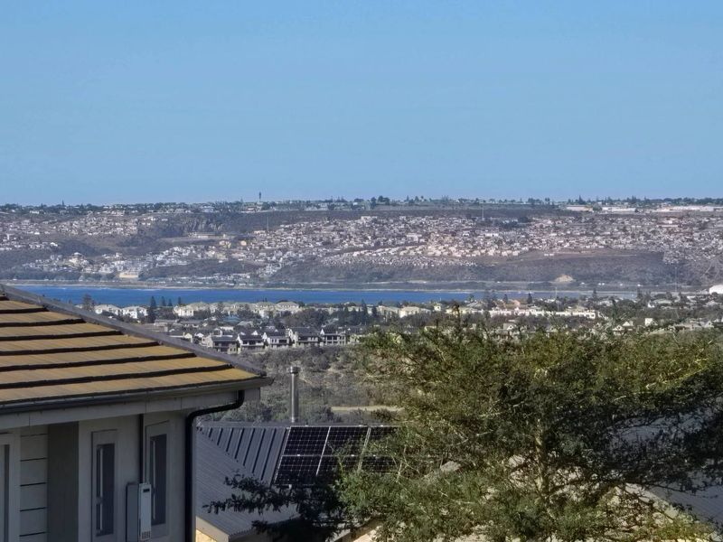 Elevated view overlooking the surrounding residential landscape and distant coastline.