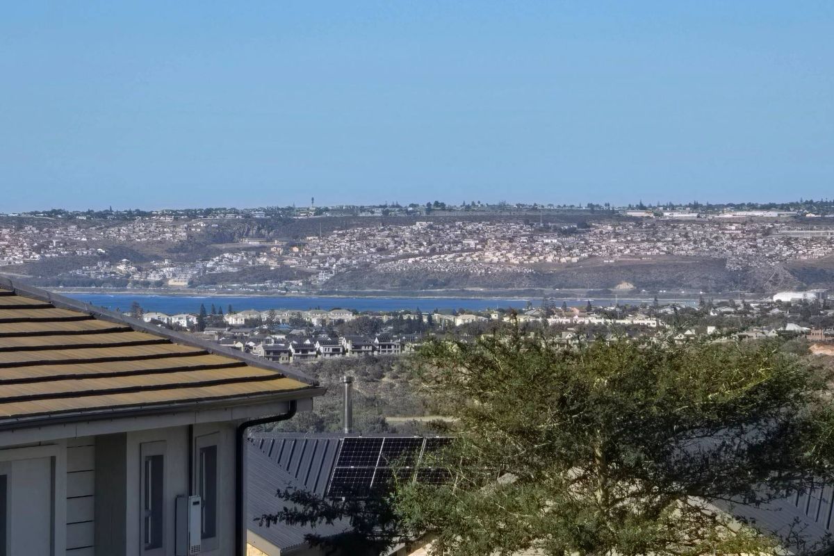 Elevated view overlooking the surrounding residential landscape and distant coastline.