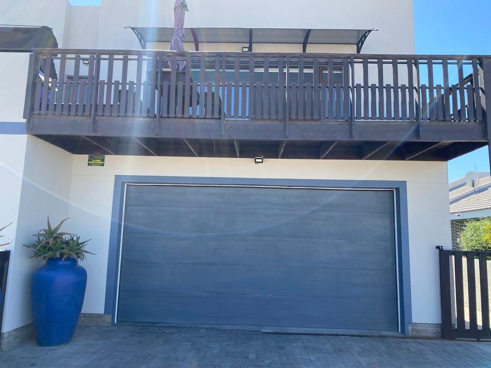 Double garage and the main bedroom balcony