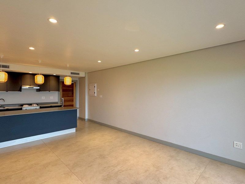 This is a premium, move-in-ready coastal apartment that combines luxury, security, and modern convenience in a sleek, never-before-lived-in space. - Photo 4