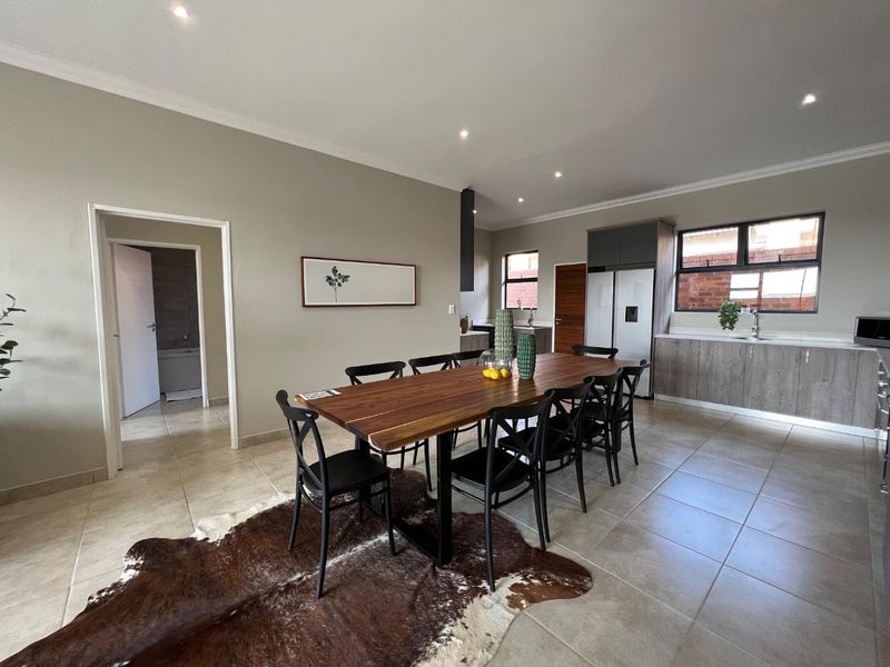 Unique iQ Marula 3-Bedroom Single-Level Townhouse with stacking doors by the patio and Double Garage - Photo 9