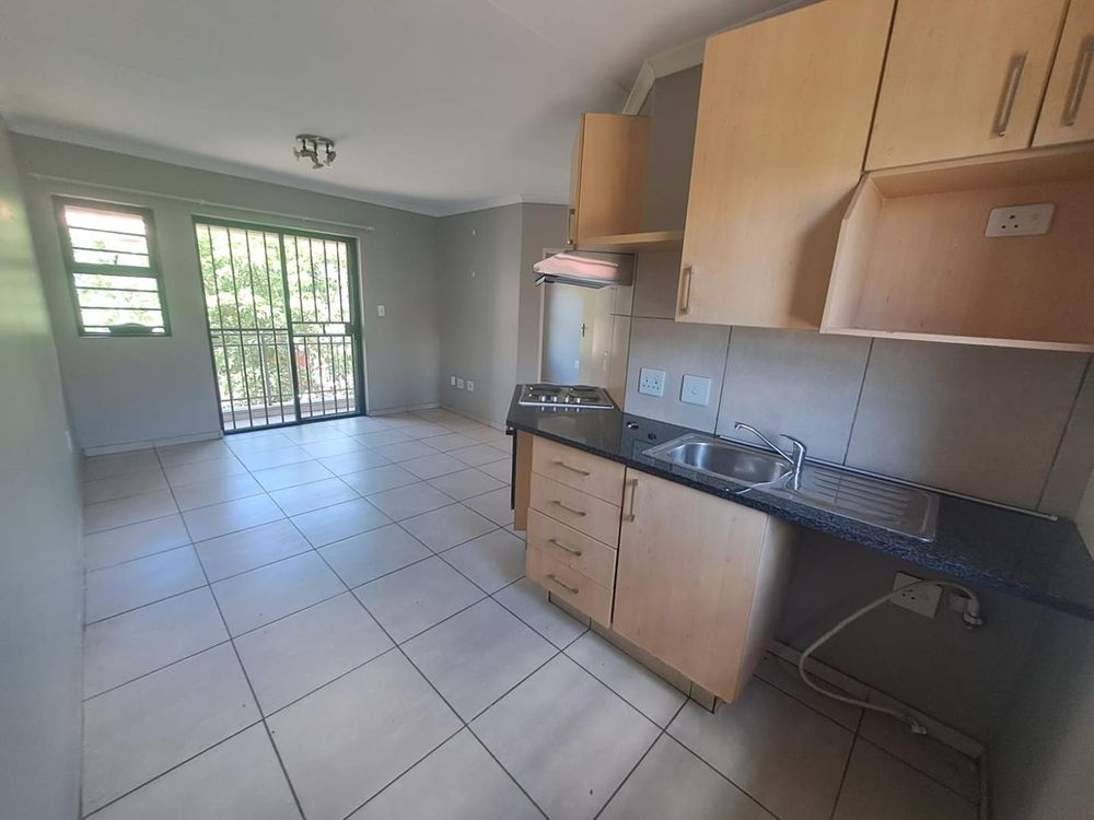 Kitchen with 4 plate stove and oven and washing machine space