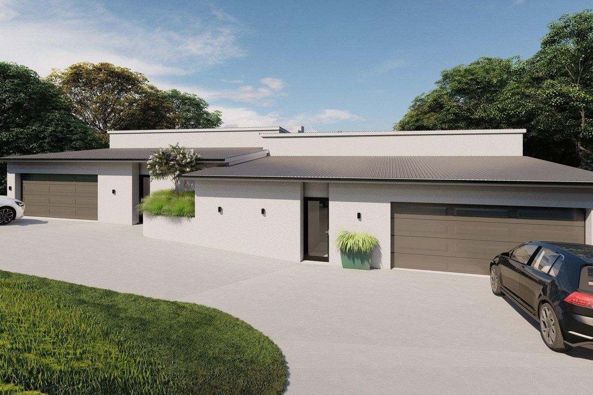 Modern front elevation featuring a clean facade, double garage, and a spacious concrete driveway.