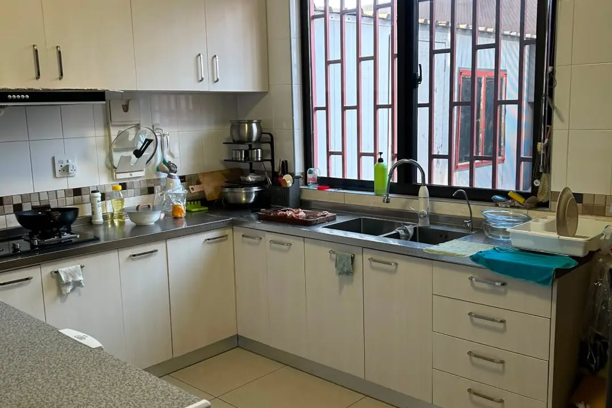 Functional kitchen featuring white built-in cabinetry, stainless steel countertops, double sink, and tiled finishes, offering a practical layout for daily meal preparation.