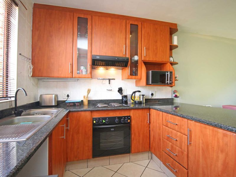 Secure living in a neat complex - Photo 4