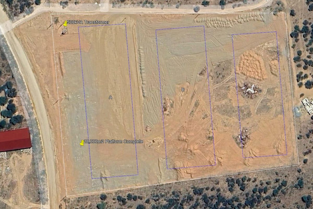 Aerial view of an industrial site featuring prepared building platforms and an on-site 500kVA transformer.