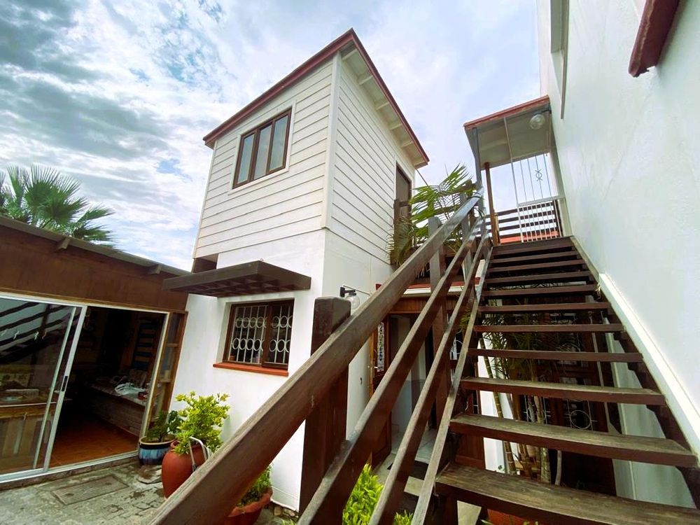Inner courtyard. Enclosed entertainment area with BBQ, entrance to kitchen and stairs to one of the bedrooms and flat 1