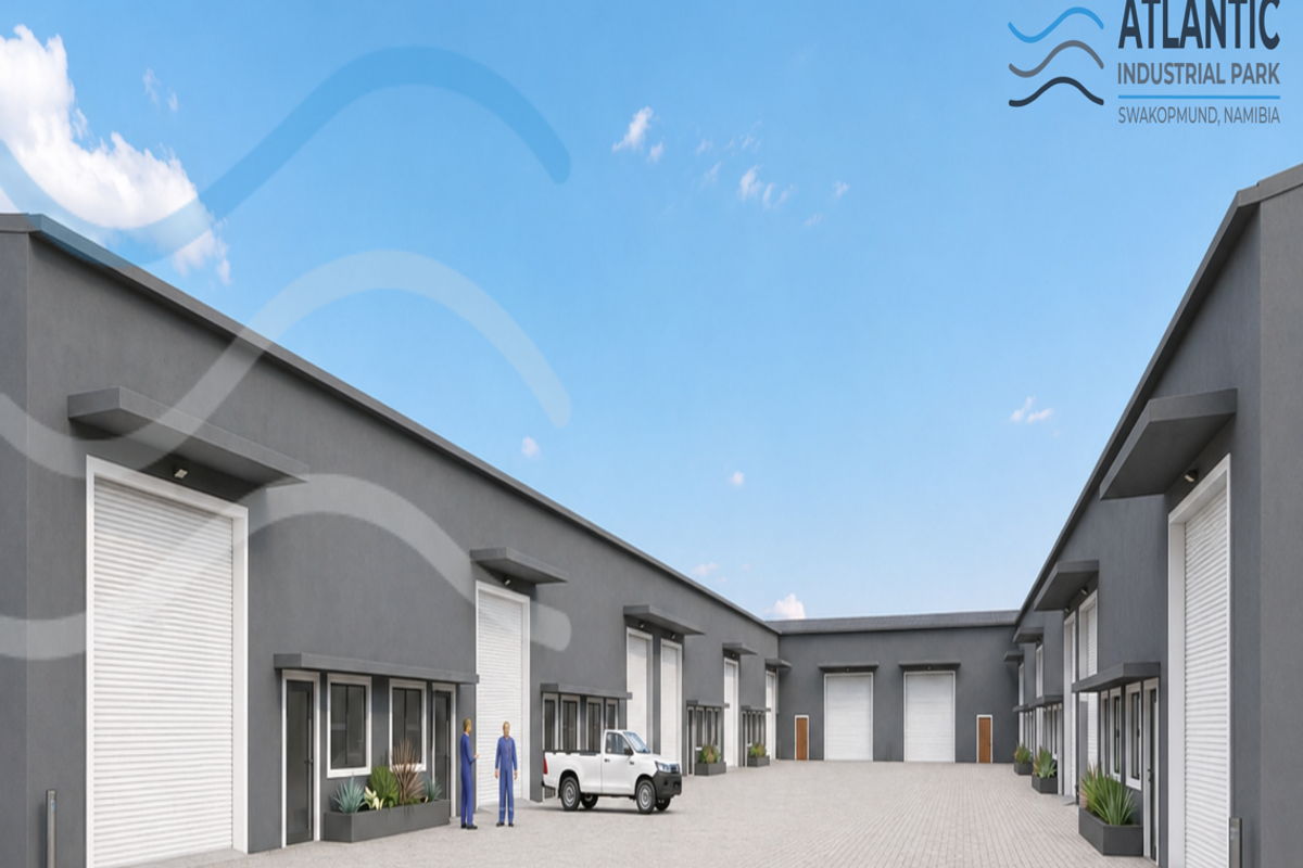 A modern industrial park featuring multiple warehouse units with roller shutter doors, paved yard space, and clean architectural lines.