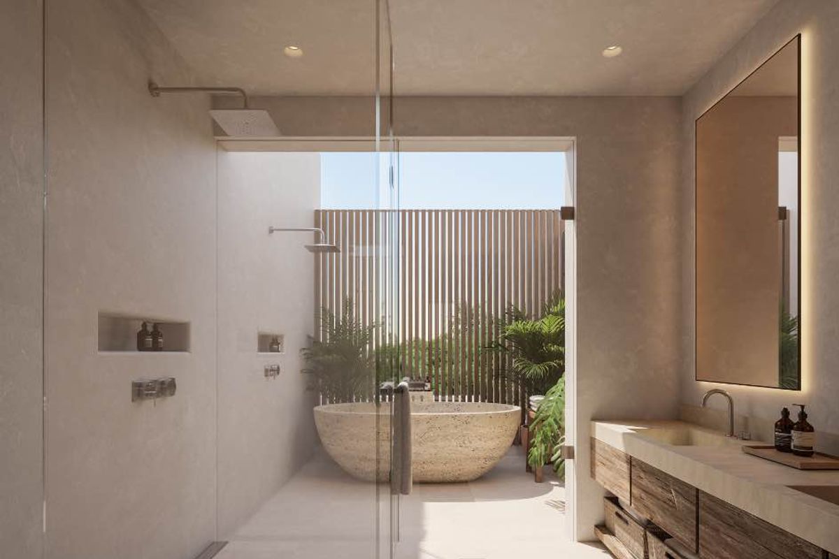 Modern luxury bathroom featuring a walk-in glass shower, stone soaking tub, and a custom timber vanity with integrated lighting.