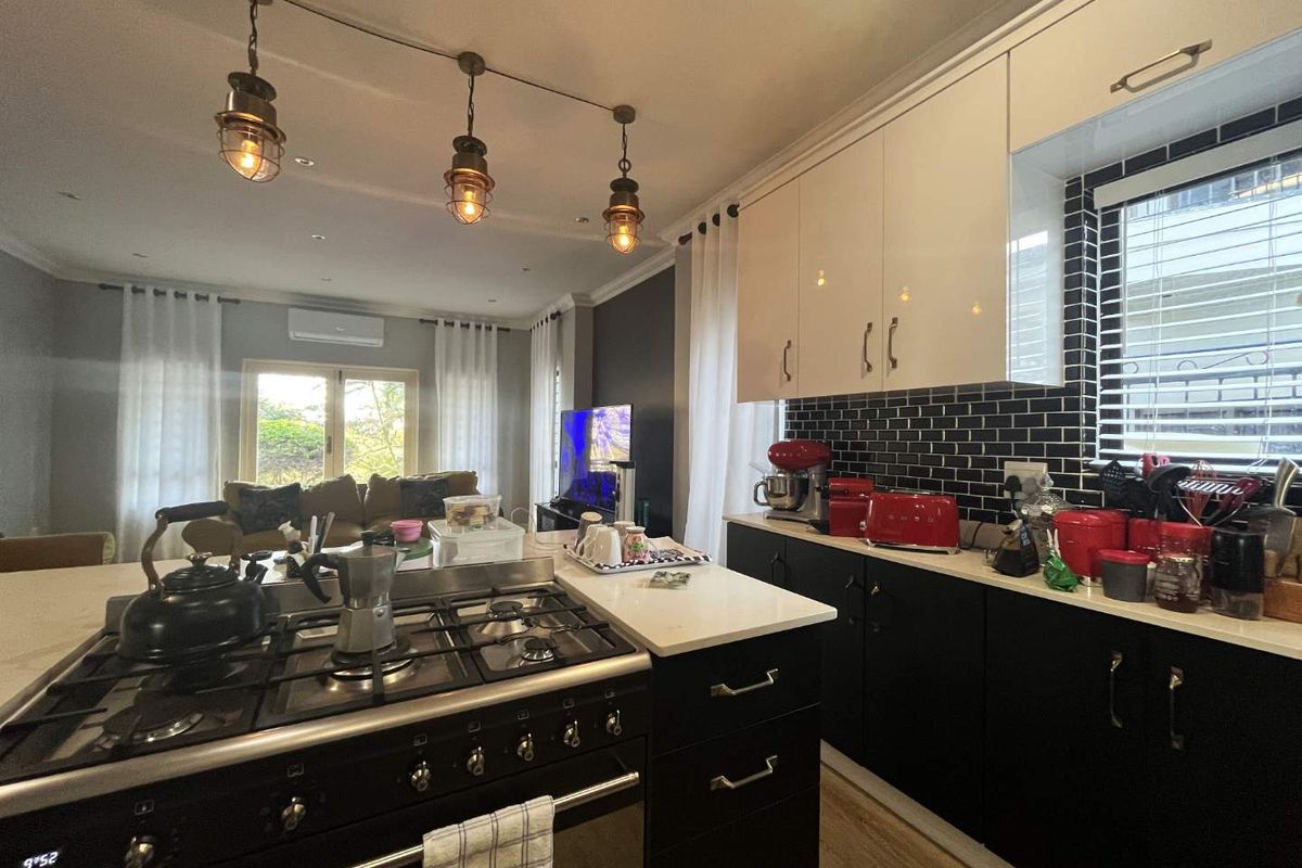 This stunning freestanding 3-bedroom family home in Seaward Estate, Ballito offers the perfect blend of coastal luxury, space, and modern convenience. - Photo 5